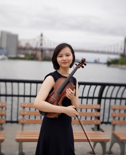 Hsuan Chen holding a violin